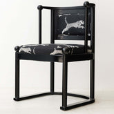 Single vintage dining chair with black fabric and leopard print upholstery